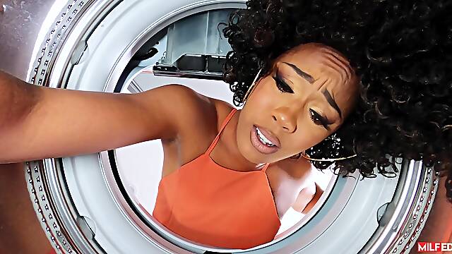 Curly ebony MILF trapped with her hands in the washing machine and moody to fuck