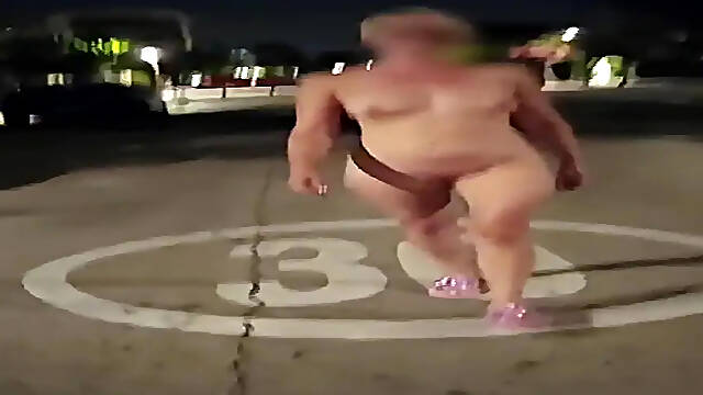 Naked blonde teases passersby with a provocative walk