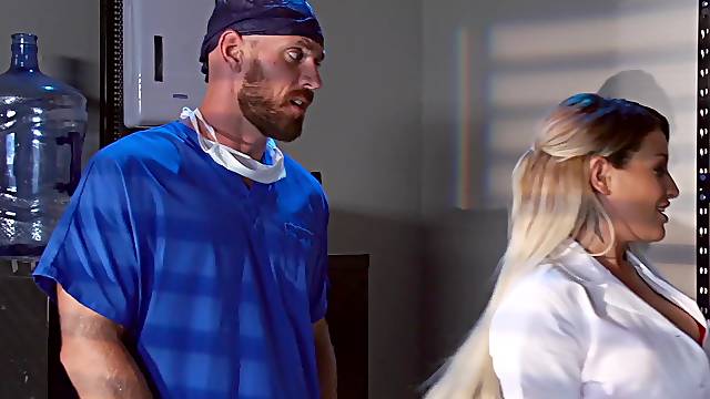 A blonde is in the hospital, having fun with the doctor on the table