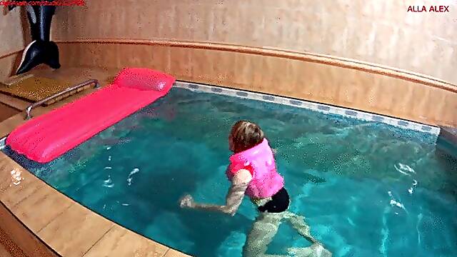 Alla wears a pink inflatable vest and rides hotly on a pink inflatable mattress in the pool!!!