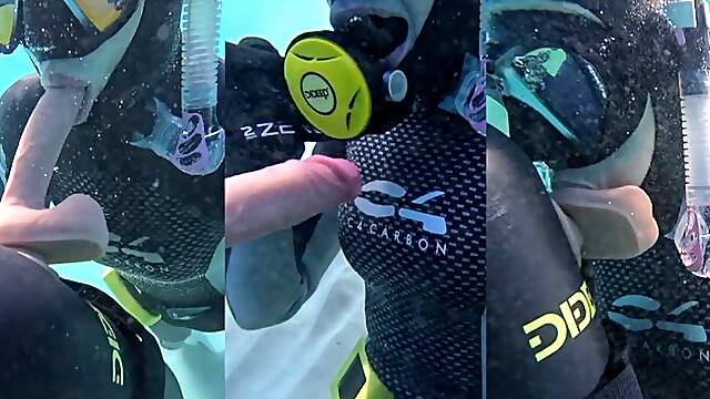 Underwater dildo blowjob at sea