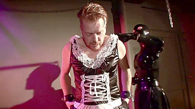 Restrained sub receives strap-on and whip treatment from dominant spandex mistress