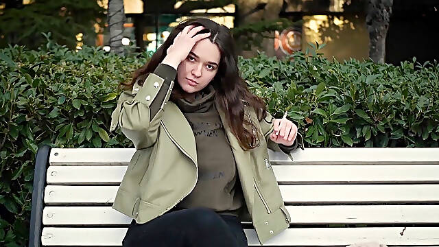 Young Brunette Is Taking an Unhurried Stroll with Allwhite 120mm Cigarette